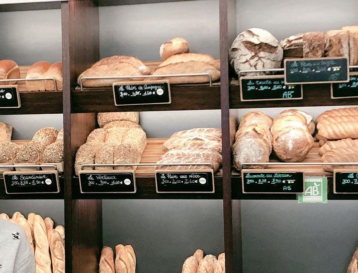 The bread is displayed behind the counter.