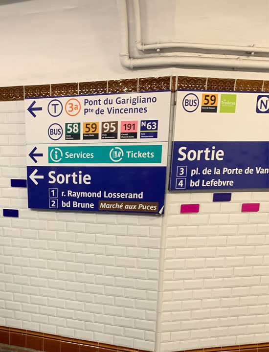 Signage in the basement of Porte de Vanves.