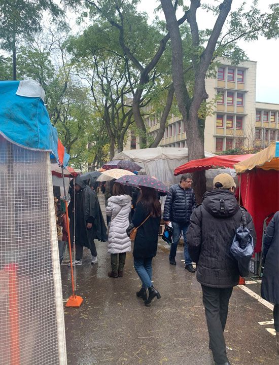 People walking through the flea market