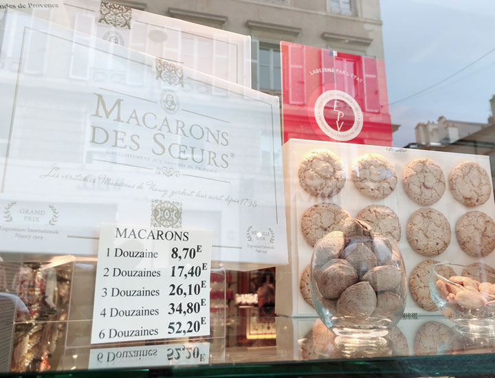 Macarons displayed in the show window.