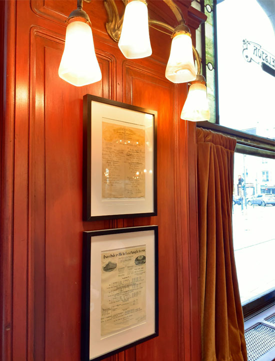 Gentle light illuminates mahogany walls.